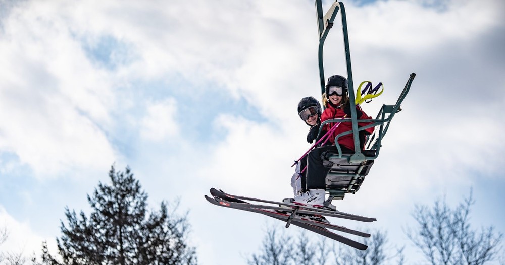 a man flying through the air while riding skis