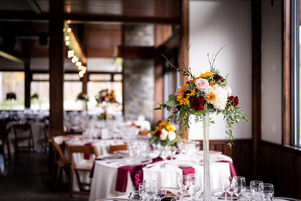 a vase of flowers on a dining room table